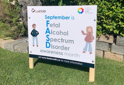 sign on lawn saying September is FASD Awareness Month