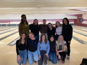 Group photo in front of a bowling ally